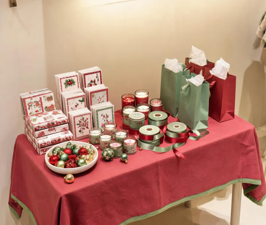 Seasonal greeting cards, ornaments, candles, and wrapped gifts